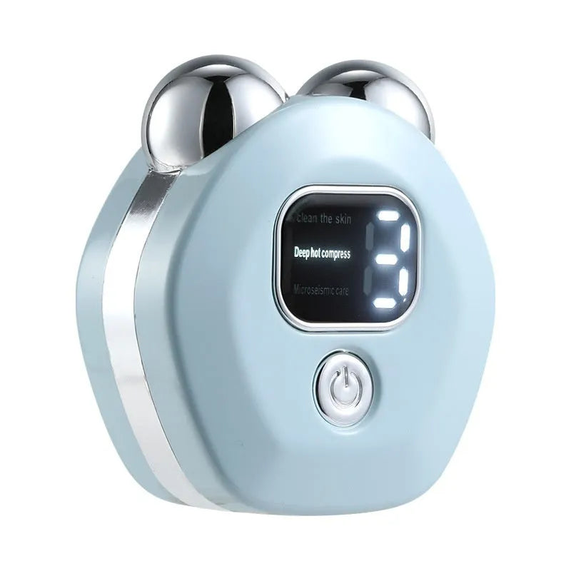 Portable white handheld facial massager with dual rollers and hot compress function on a pink background