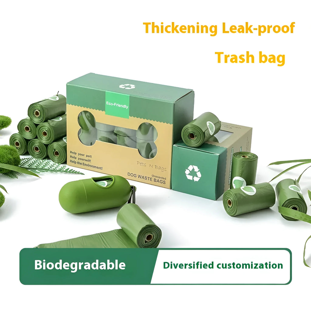 Roll of green EPI degradable pet garbage bags next to a boxed set with a dispenser.