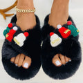 Women's Christmas hat themed slippers in faux plush with a rubber sole and cotton lining.