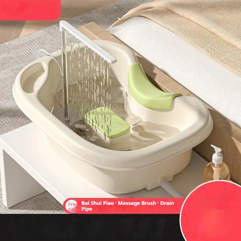Home shampoo basin with neck pillow and water pump for use while lying down in bed