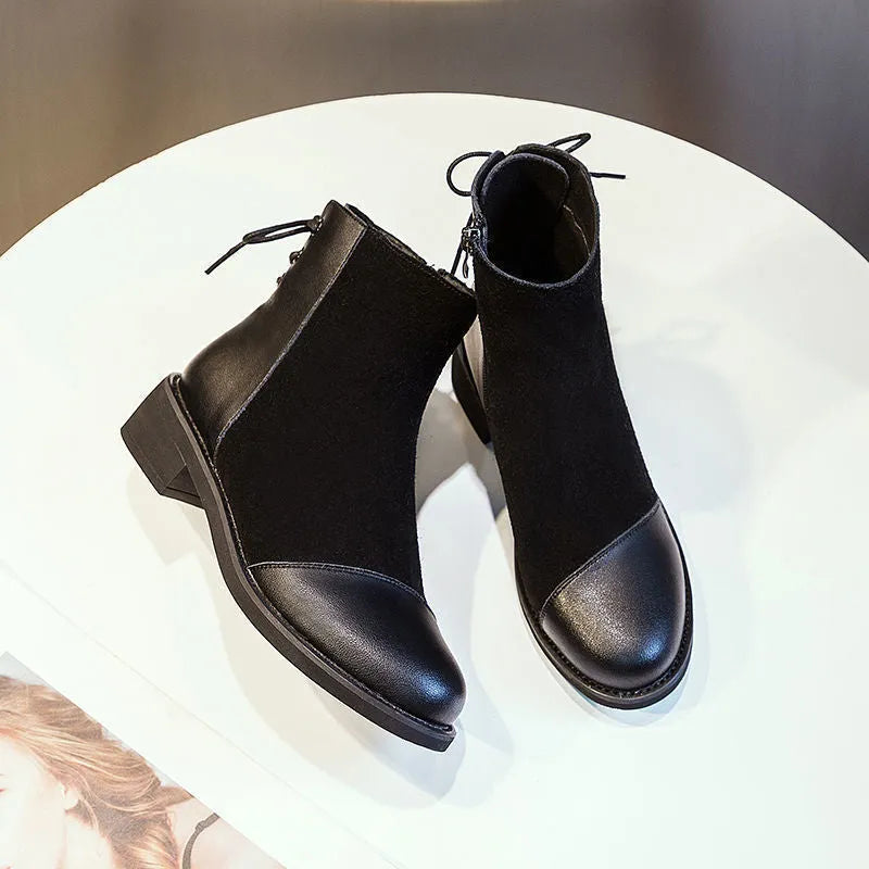 Women's black soft leather Martin boots with side zip and round toe design