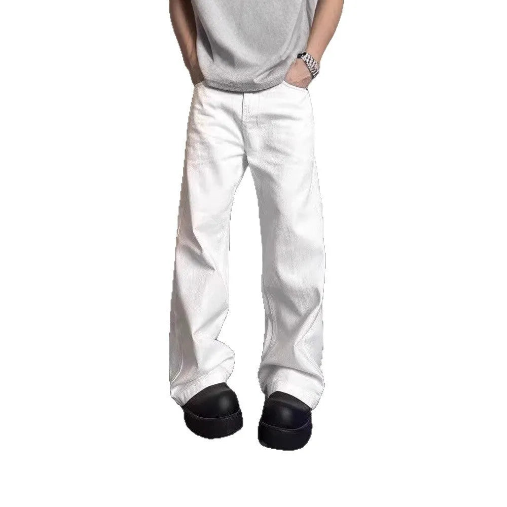 White men's straight-leg jeans with a wide loose cut on a mid waist, featuring a zipper fly.
