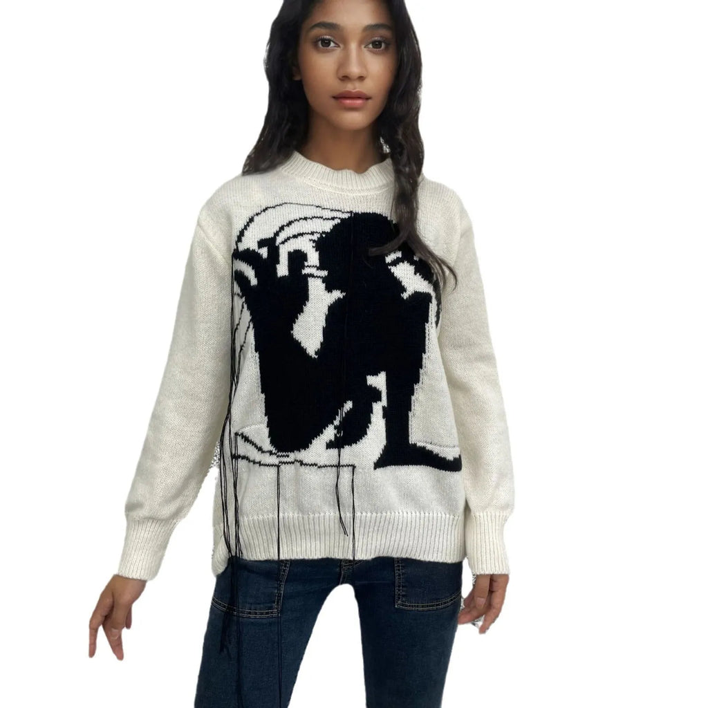 Women's loose grey alpaca wool sweater with tassel detailing and abstract pattern