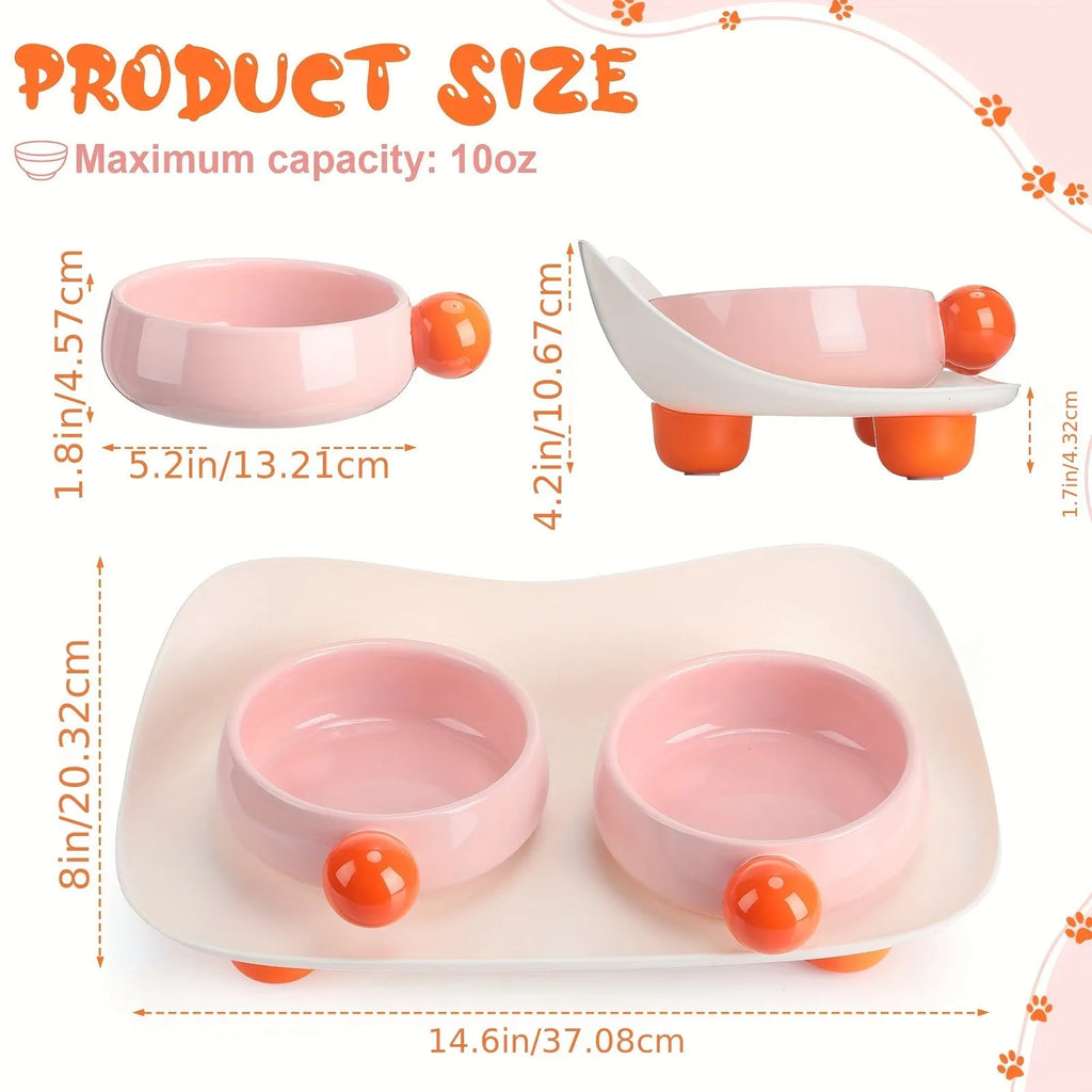 Pink ceramic double pet bowl set with raised non-slip base for cat food and water.