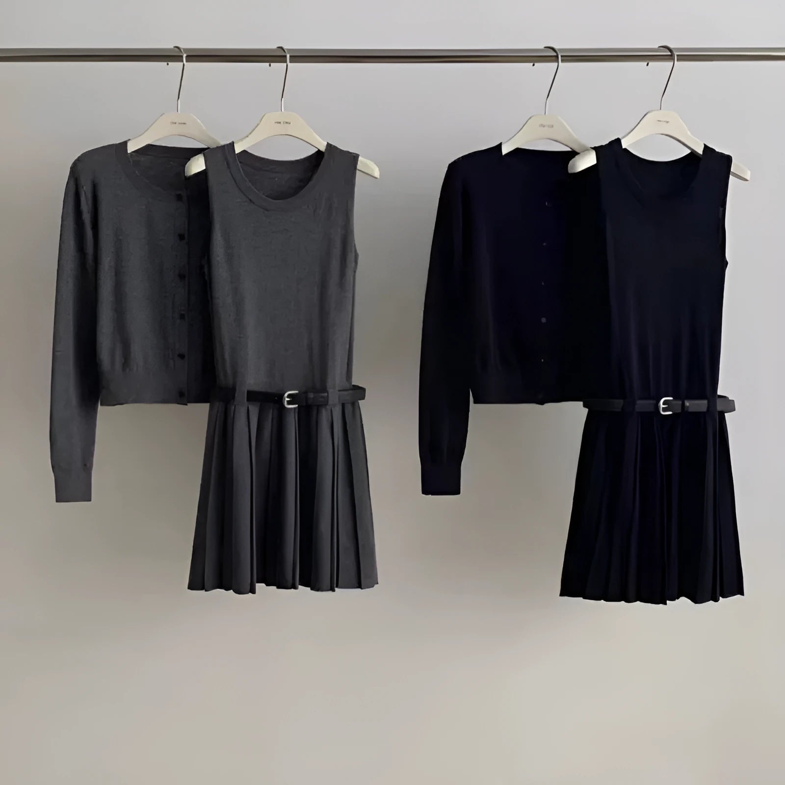 Grey art retro women's vest skirt and long-sleeve cardigan two-piece set with pleats and belt.