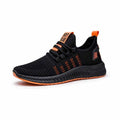 Men's black casual sports shoes with stripe and cross-strap detail on a Flying Weave upper.