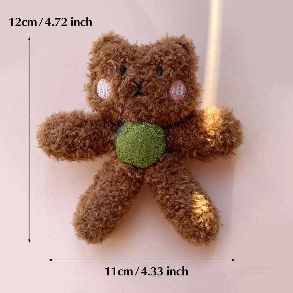 Brown bear shaped stuffed catnip ball edible chewing toy for cats on a white background.