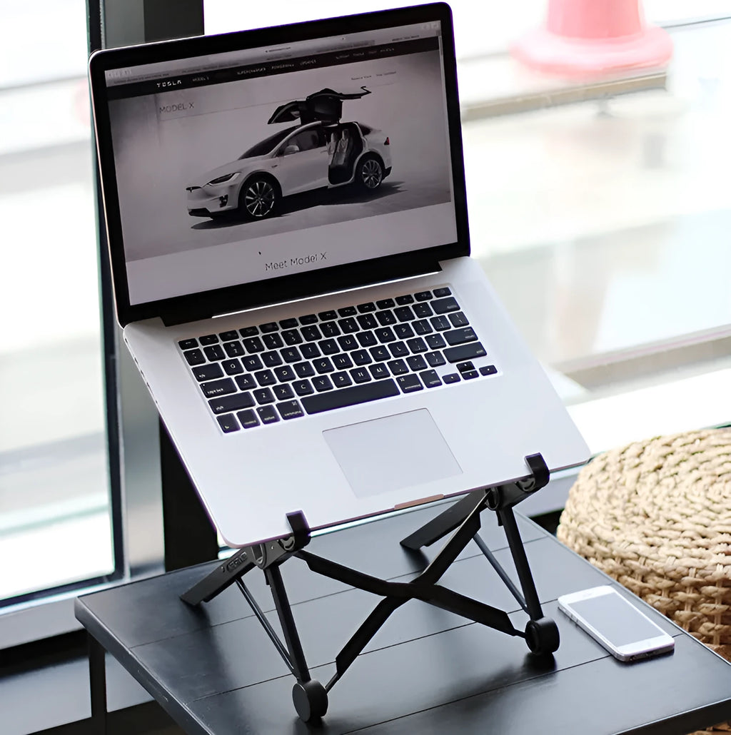 Black folding portable laptop stand showing folded dimensions of 35.4cm wide