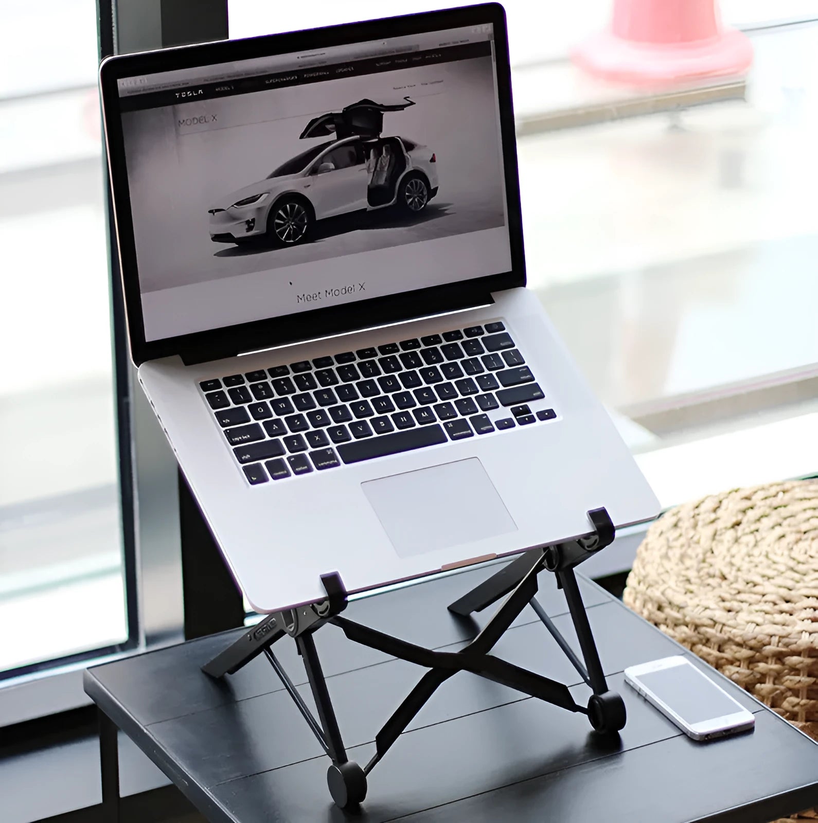 Black folding portable laptop stand showing folded dimensions of 35.4cm wide