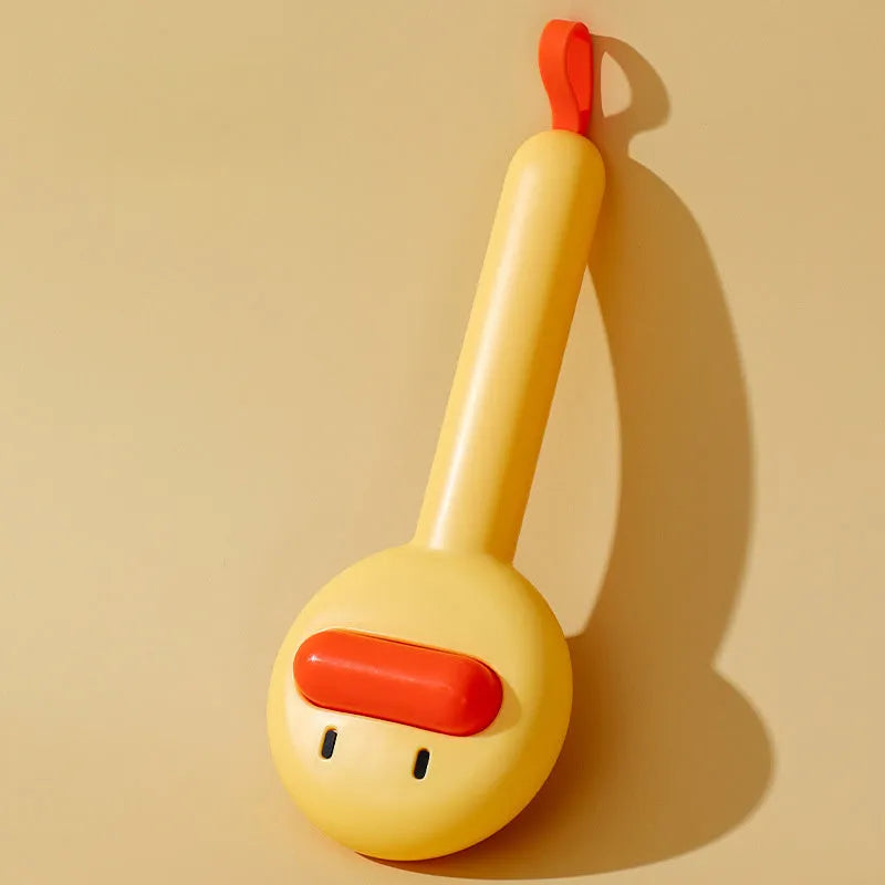 Small yellow duck-shaped pet grooming comb with stainless steel needles