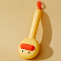 Small yellow duck-shaped pet grooming comb with stainless steel needles