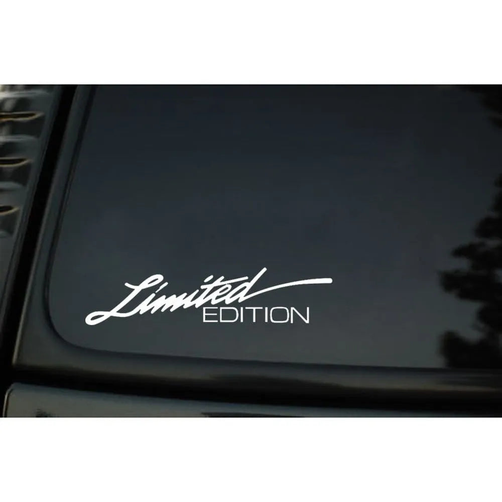 Close-up of a reflective plastic bumper sticker showing British style text, measuring 16cm long.