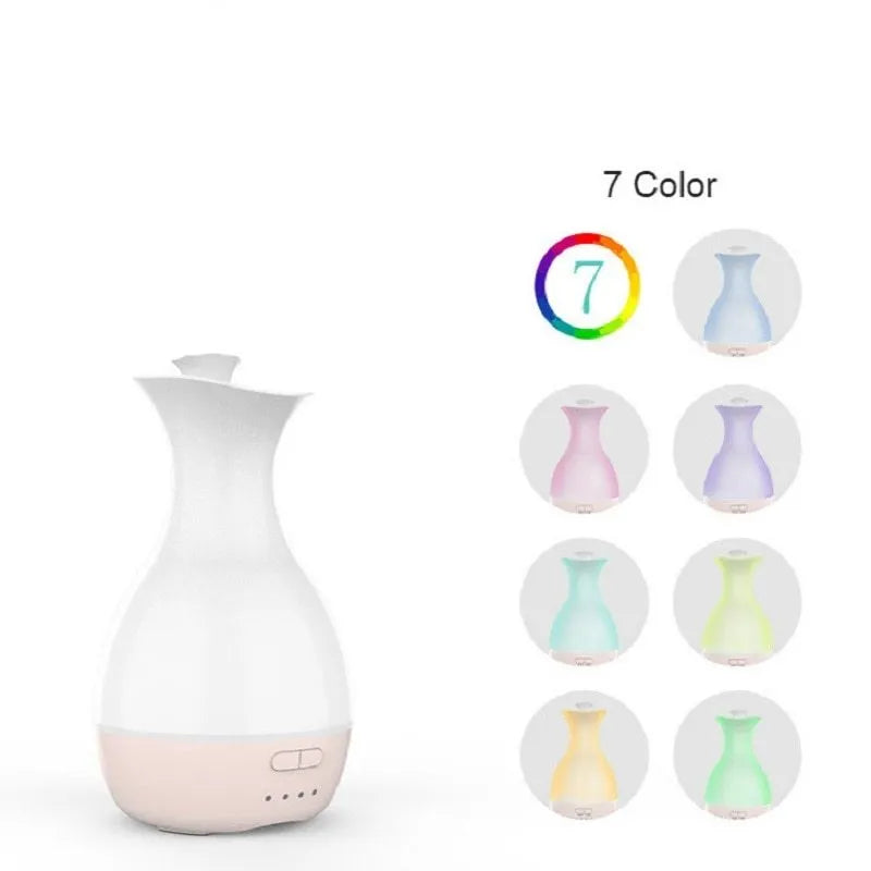 White ultrasonic aromatherapy vase humidifier with colourful LED night light and 200ml water tank.