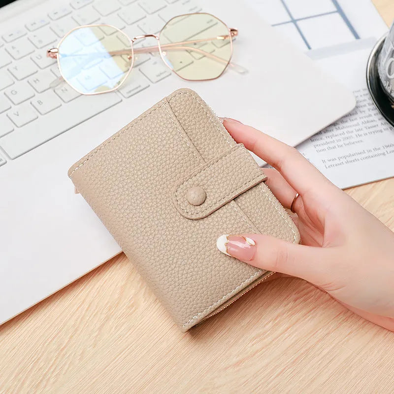 Lychee pattern short wallet in beige with organiser compartments and sewing thread detailing