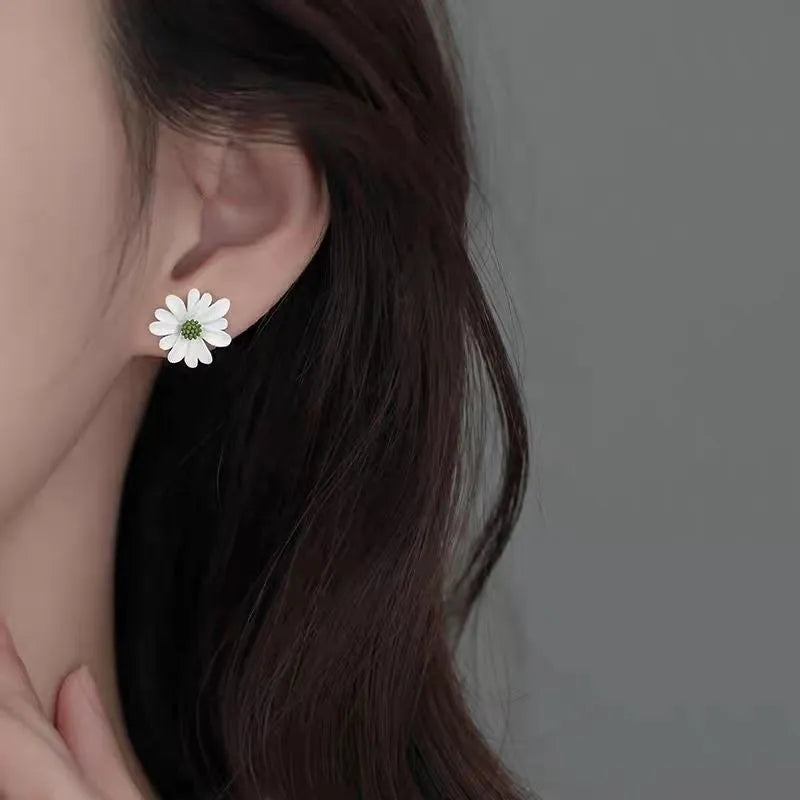 Alloy cartoon flower stud earrings in blue and orange, white and green, or yellow and white two-tone colours.
