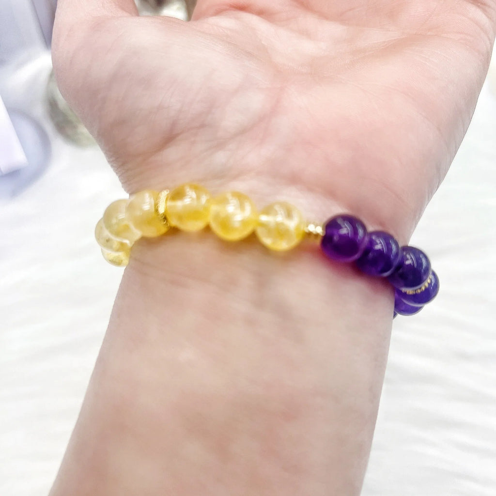 Handmade women's amethyst crystal bracelet with yellow and purple beads