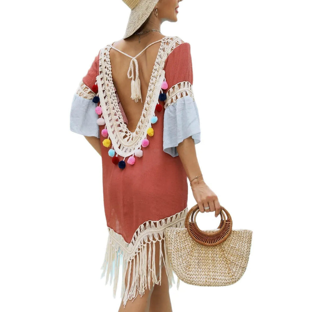 Orange floral pattern beach overskirt with hand crochet stitching and tassel details.