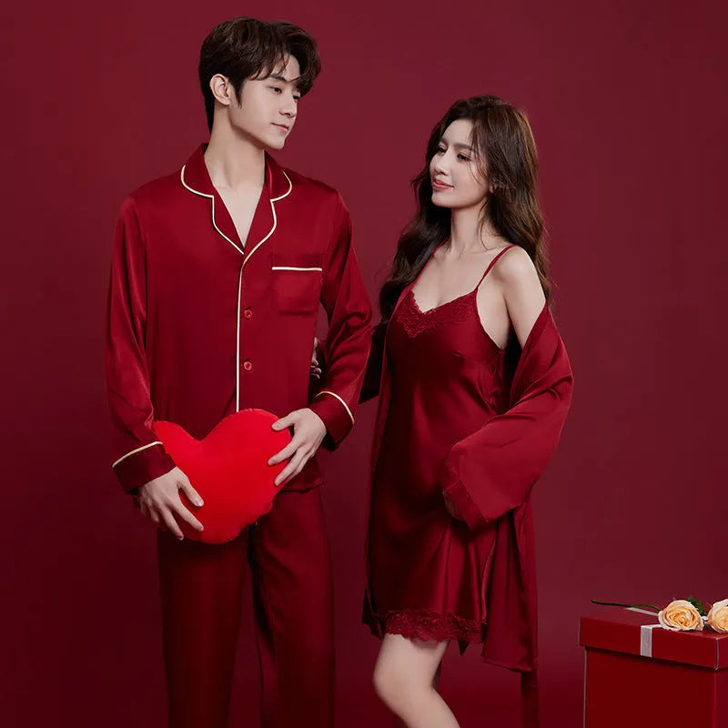 Red men's and women's long sleeve ice silk pyjama set laid flat.