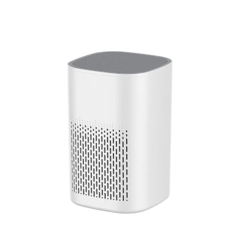 Simple style desktop air purifier with USB cable on a wooden desk.