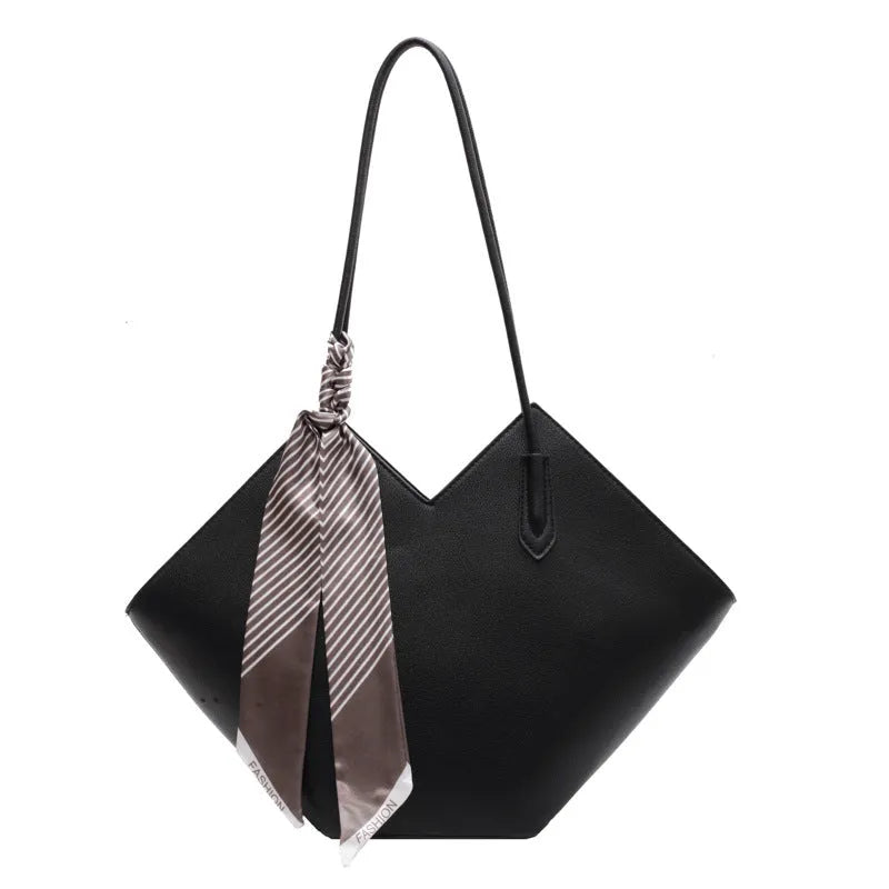 Women's large black PU leather shoulder bag with square shape showing exterior pocket and adjustable handle