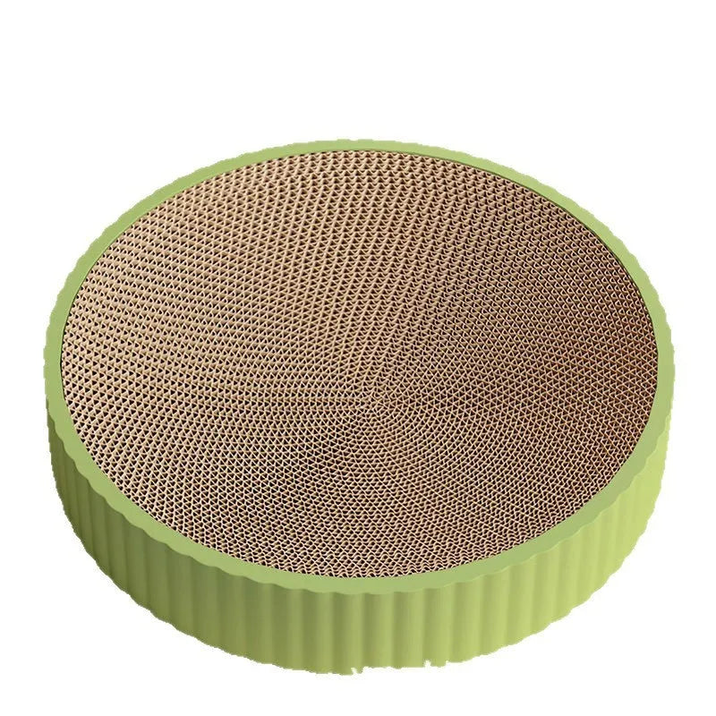 Green round corrugated cardboard cat scratching board measuring 55cm with two replacement pads.
