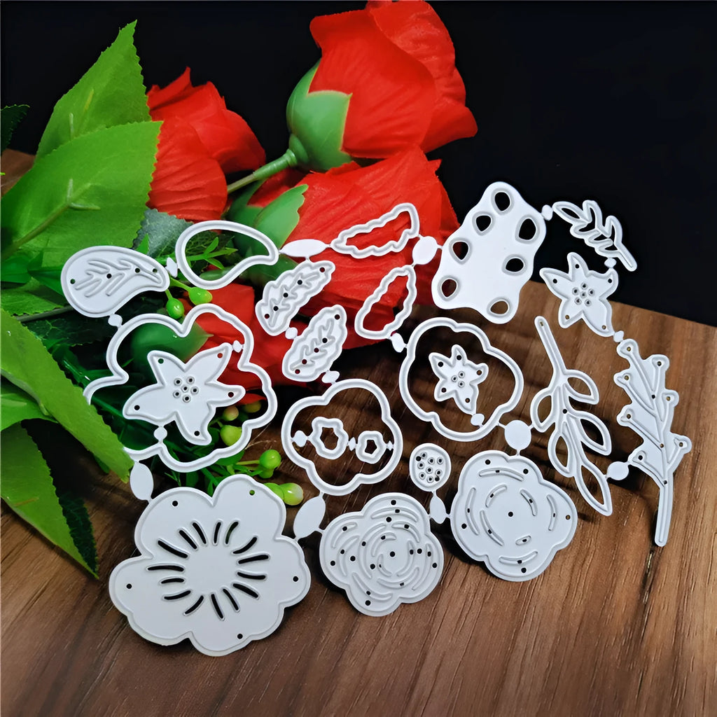 Silver carbon steel paper cutting mould with etched floral design measuring 14.3 by 9.9 centimetres
