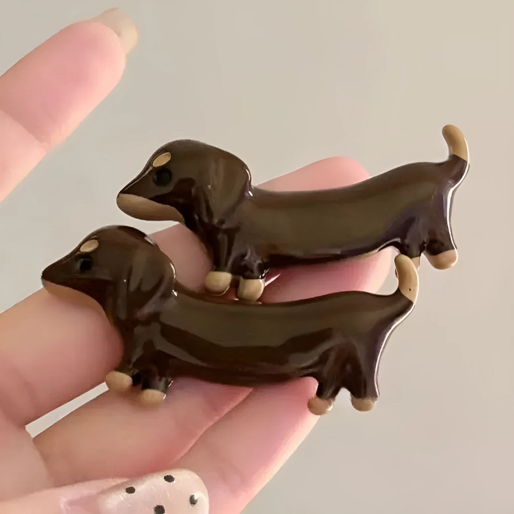 Close-up of a cute dachshund dog hair barrette with an electroplated finish.