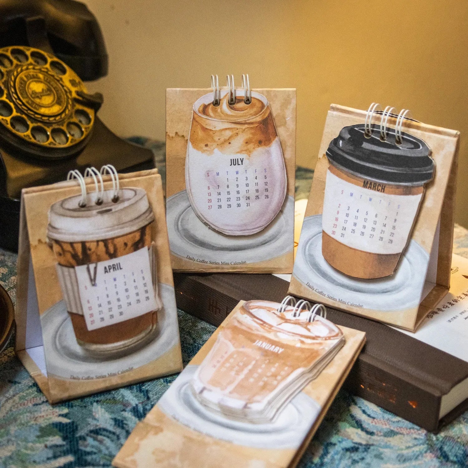 Mini coffee-themed desk calendar showing 2025 dates with motivational text