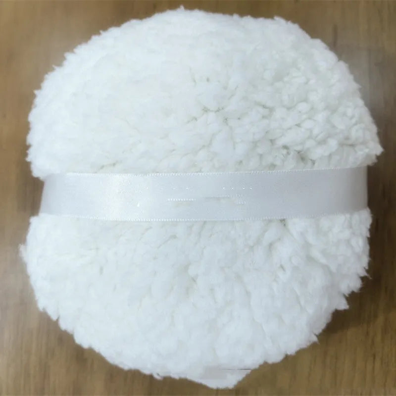 Oversized rectangular plush powder puff measuring 150x75mm in white colour