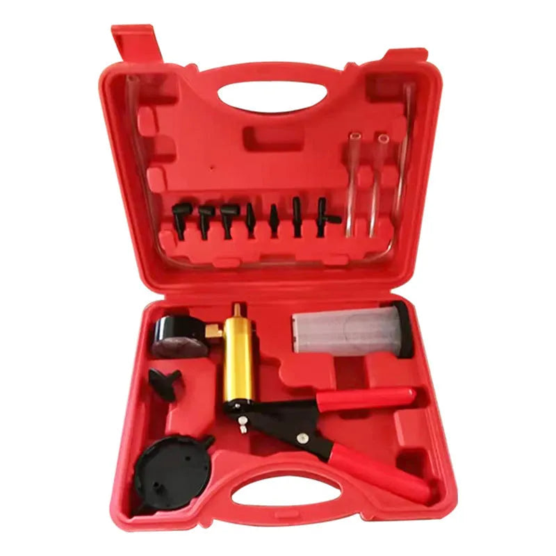 Aluminium manual vacuum air blow gun and suction tool for automotive repair on a workshop bench.