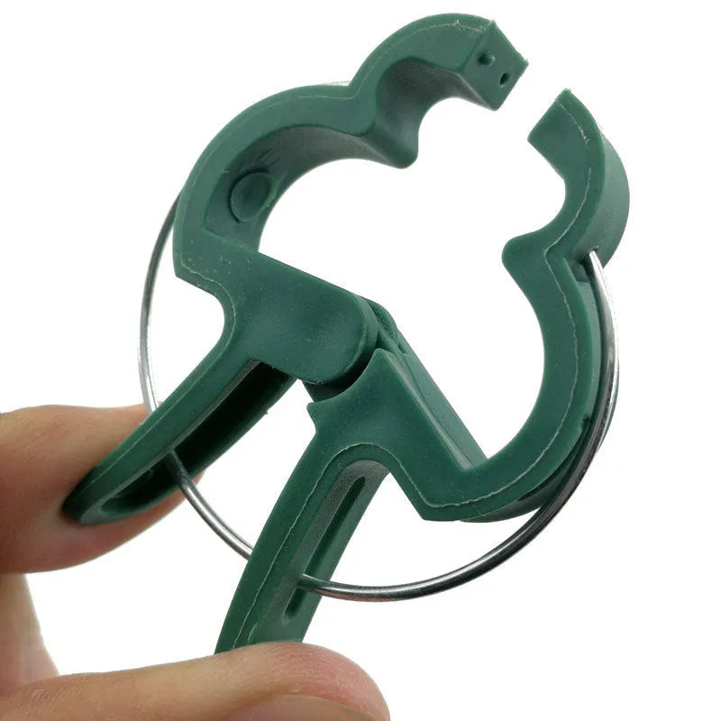 Green plastic and zinc plant fixing clips: 10 large and 10 small for climbing plants.
