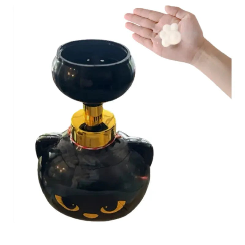 Black plastic cartoon cat shaped foam soap dispenser measuring 10 by 18 centimetres