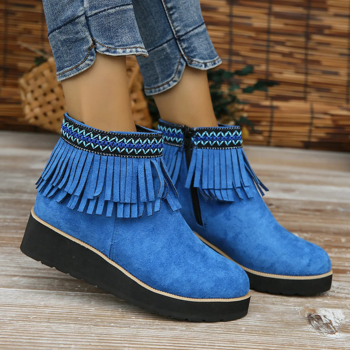 Women's black suede wedge ankle boots with a thick platform sole and side zipper.