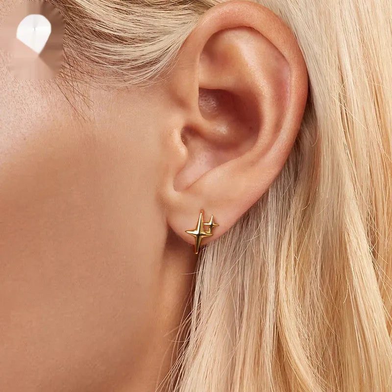 Sterling silver minimalist star ear clip accessories with oxidised finish on ear
