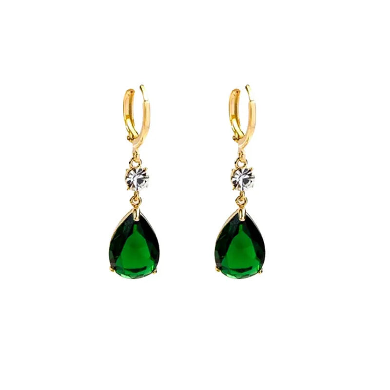 A pair of green geometric teardrop alloy earrings on a plain background.