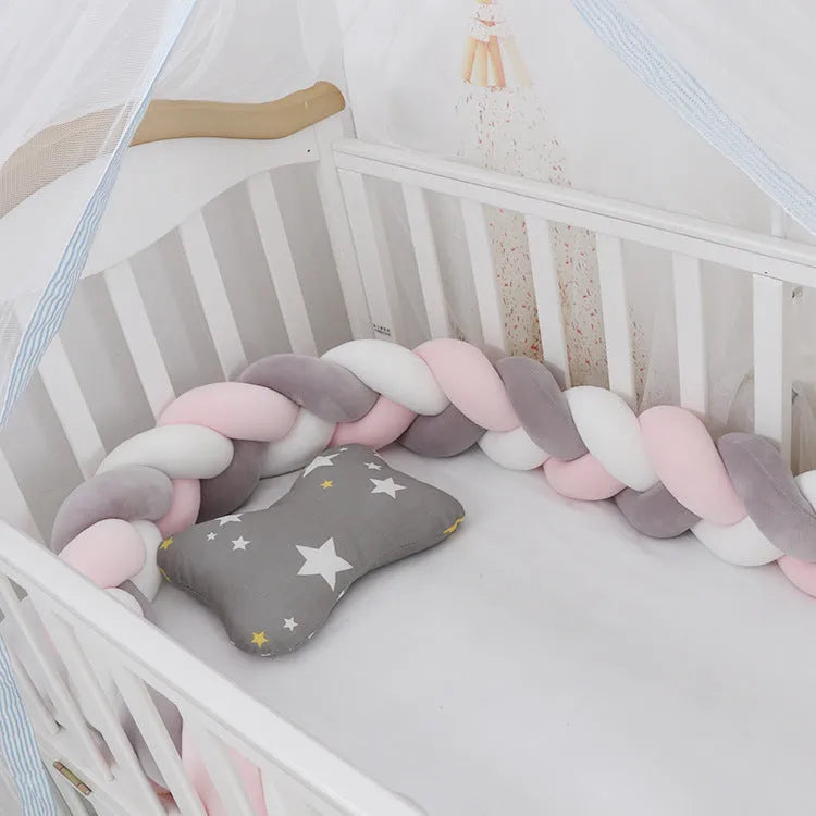 Braided knot cot bumper cushion in spandex velvet for crib safety protection.