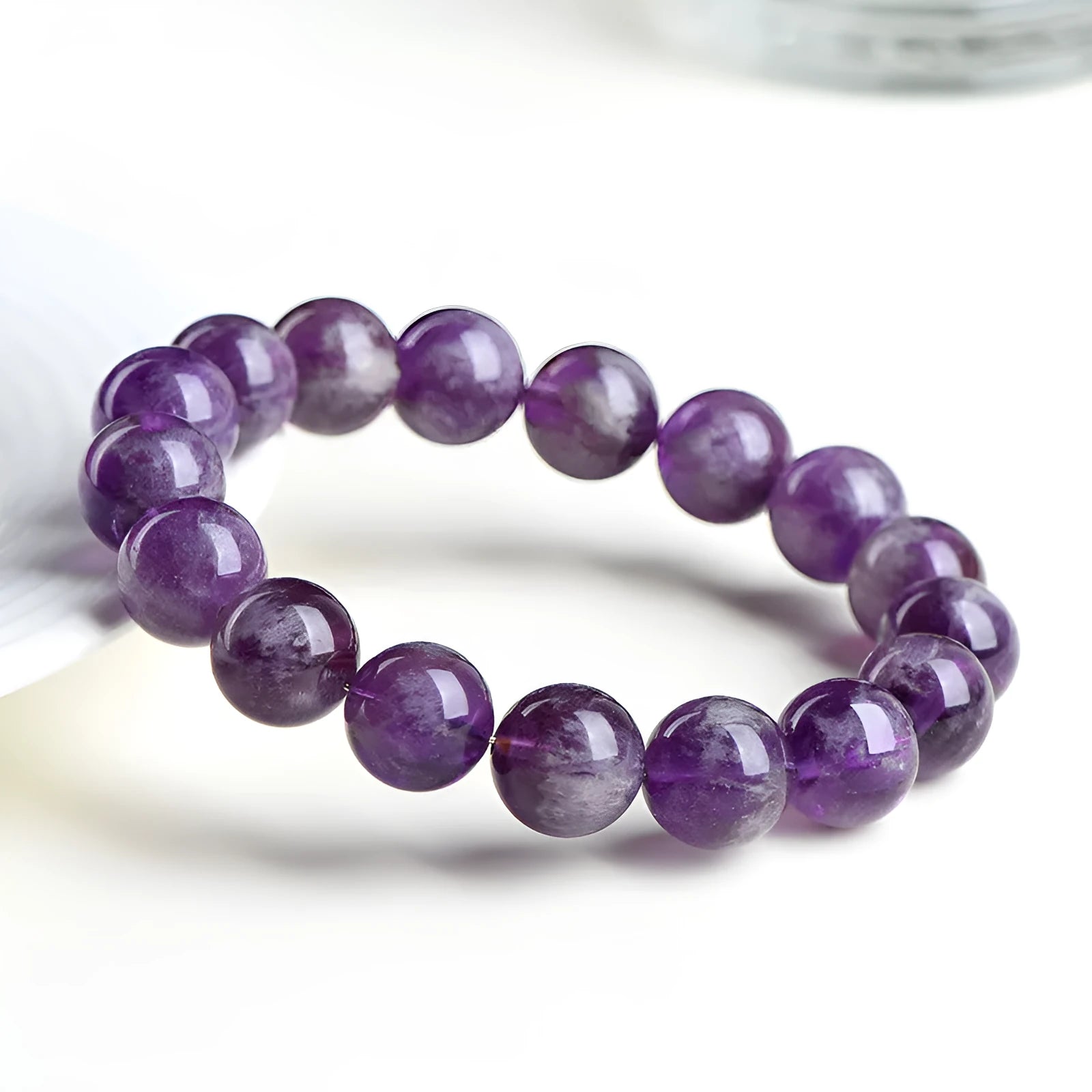 Natural purple crystal bracelet with scattered beads and Ruyi symbol design in various size options.