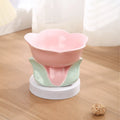 Blue ceramic raised pet bowl with floral pattern and non-slip base for cats and small dogs.