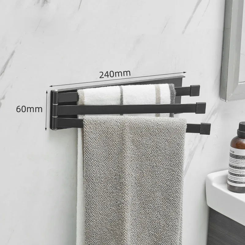 Nordic style black folding towel rack mounted on a white bathroom tile wall.