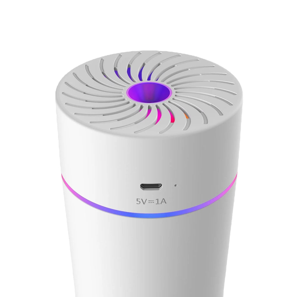 Compact black car USB humidifier with aromatherapy function placed in a vehicle cup holder.