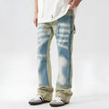 Retro yellow and blue patchwork jeans with splash-ink distressing, mid-waist cut with zip fly