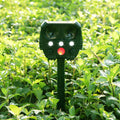 Green solar-powered ultrasonic animal repeller with motion sensor for outdoor pest control.