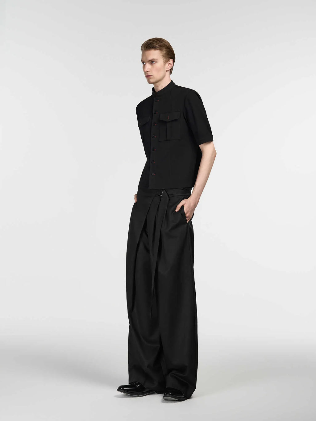 Black straight-leg trousers with adjustable waist and single pleated detail in tencel-cotton blend
