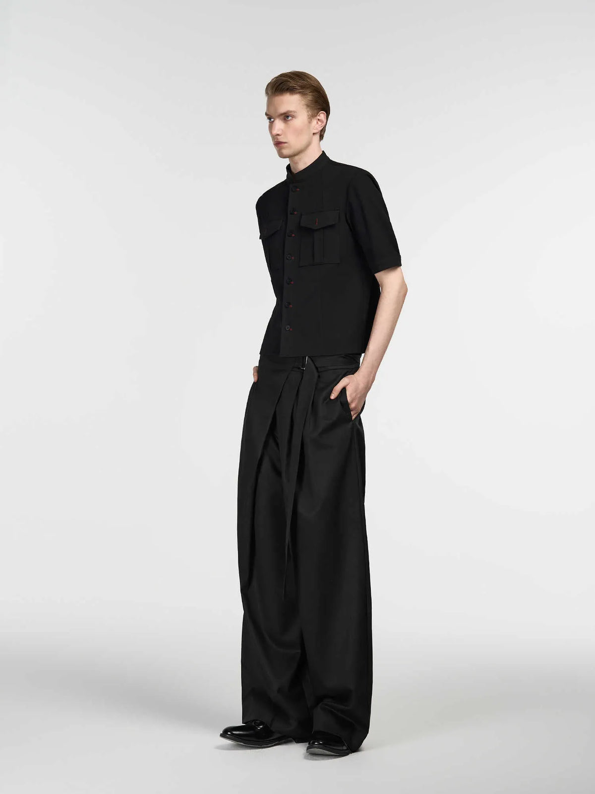 Black straight-leg trousers with adjustable waist and single pleated detail in tencel-cotton blend