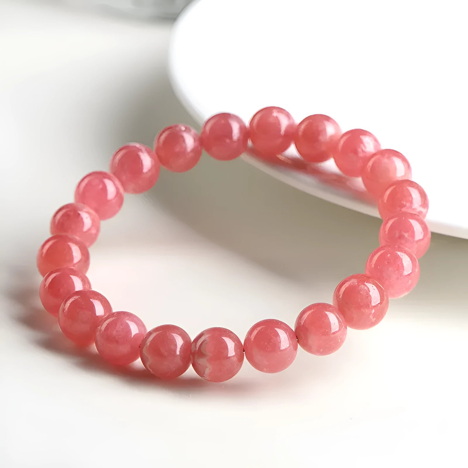 Women's geometric crystal bracelet with Longevity Lock in natural red rhodochrosite stone.