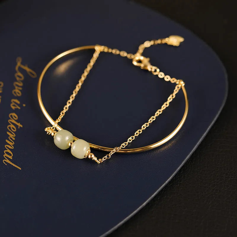 Women's jade lucky beads bracelet with gold inlay, showing single, double, and three bead version options.