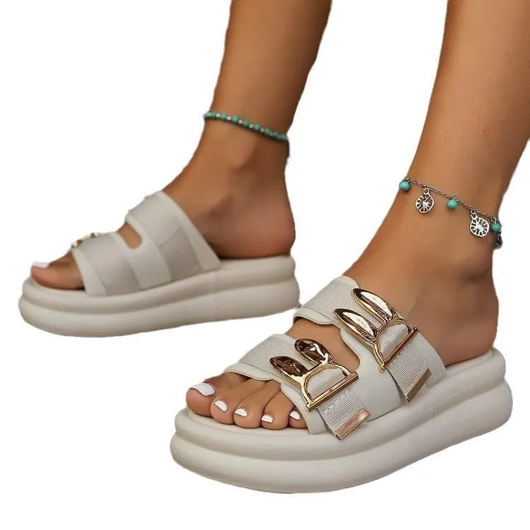 Women's apricot suede slippers with thick rubber soles shown from the side