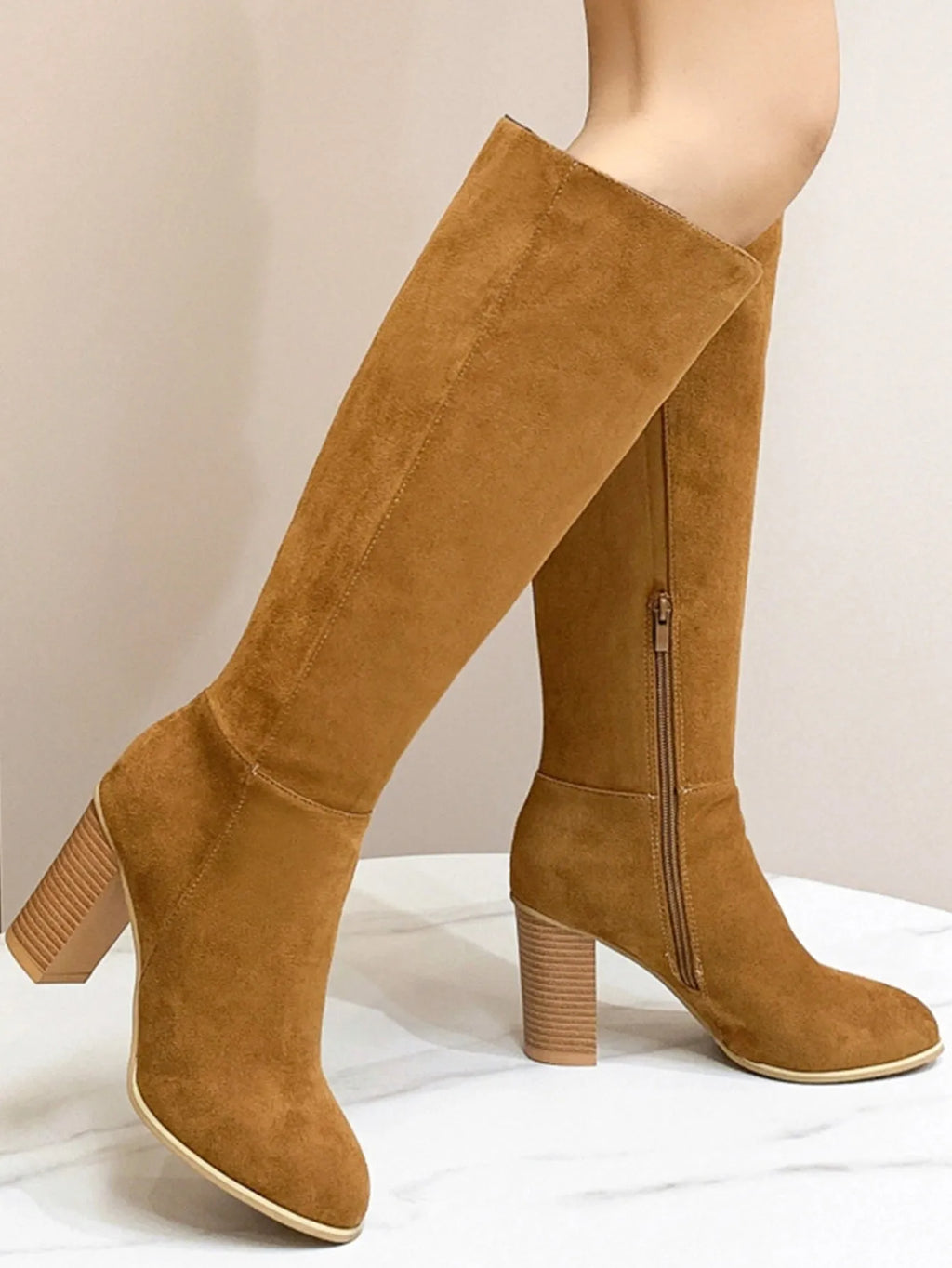 Women's black square toe high heel fashion boots made from artificial PU material.