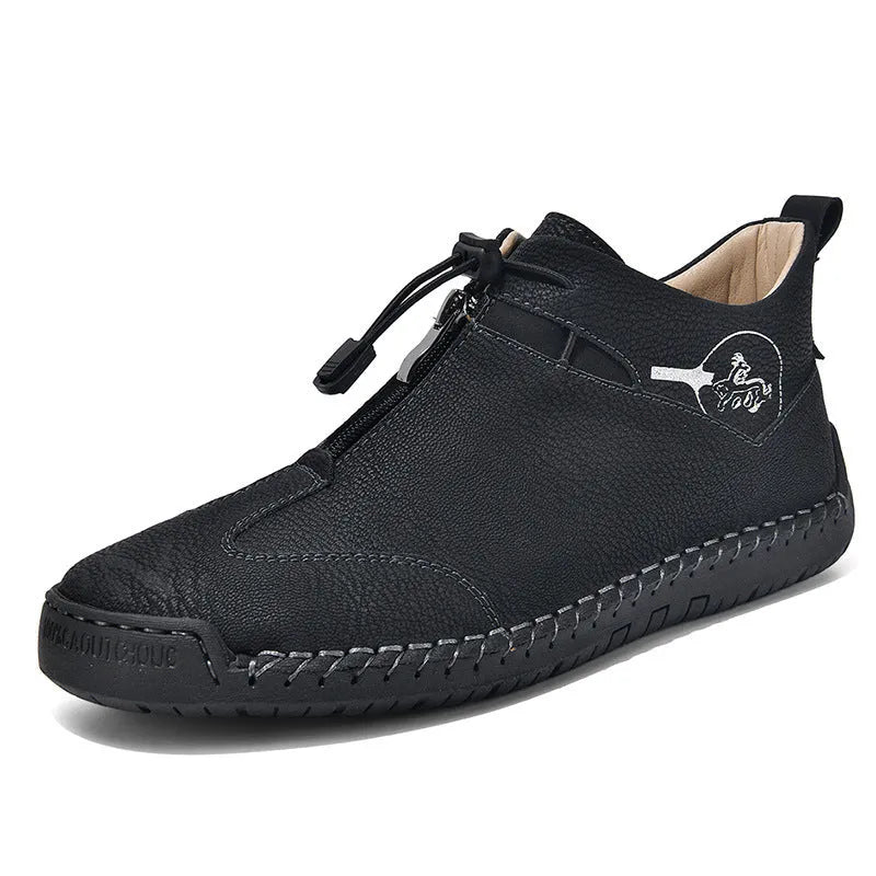 Men's black casual leather shoes with a mid-heel and rounded toe on a neutral background