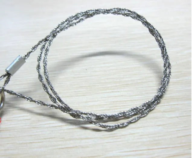 Portable outdoor wire saw with stainless steel blade and pull rings for camping cutting